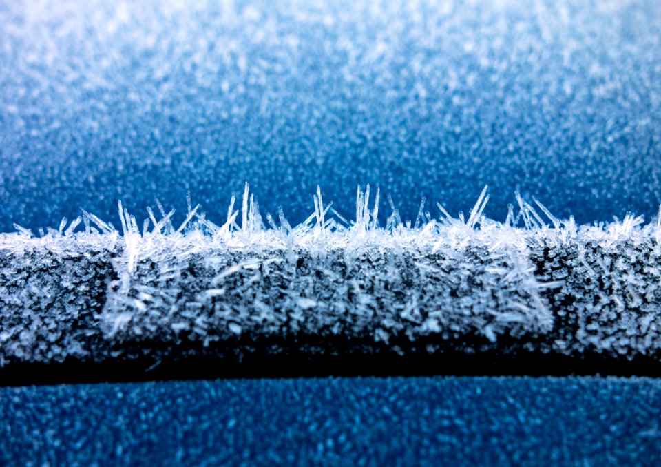 Hoar frost on a blue car 6 photo