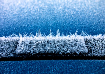 Hoar frost on a blue car 6 photo