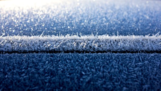 Hoar frost on a blue car 2 photo