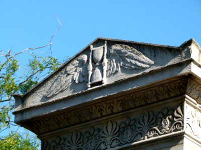 Hourglass scultpture on the entry to Montparnasse Cemetery photo