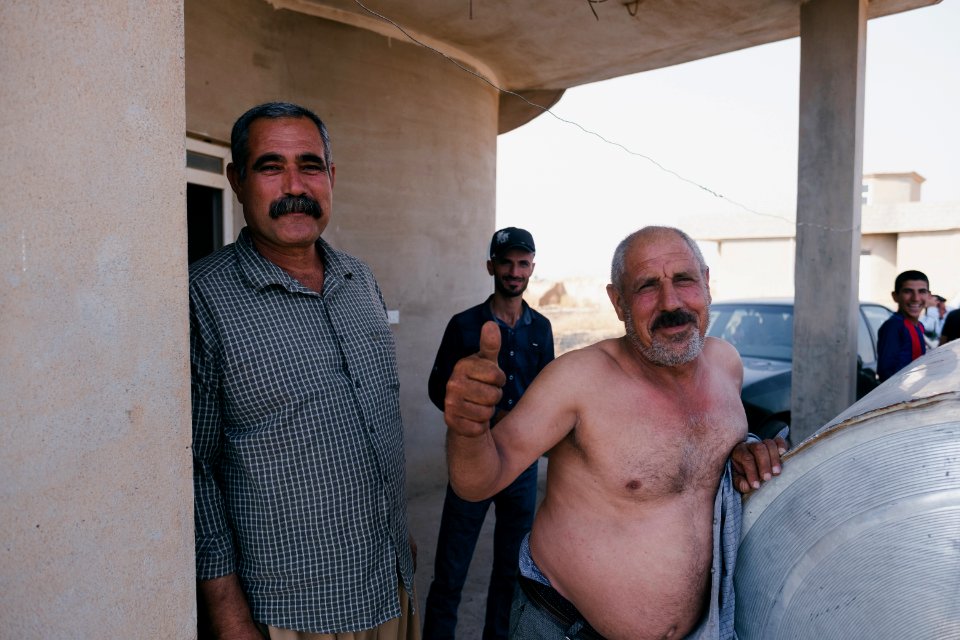 Interviewing Ezidi truck drivers waiting for work at a house near Hardan village in Sinjar region 39