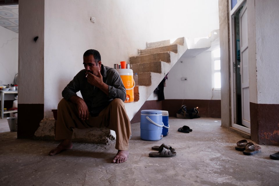 Interviewing Ezidi truck drivers waiting for work at a house near Hardan village in Sinjar region 16