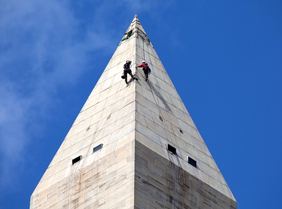 Workers rappelling maintenance