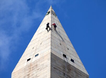 Workers rappelling maintenance