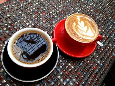 Black coffee red cup latte foam