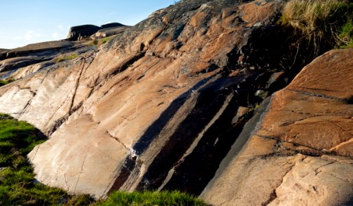 Humus-rich water on a cliff photo