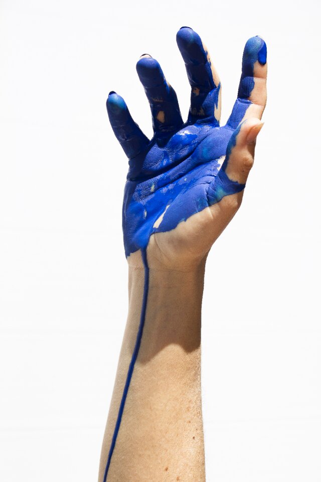 Blue painting hands