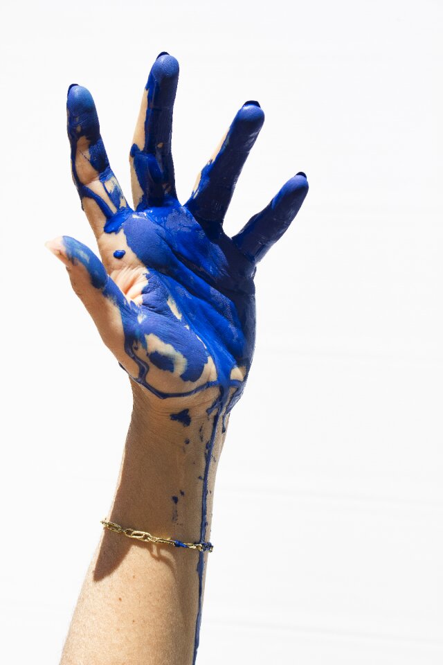 Blue painting hands