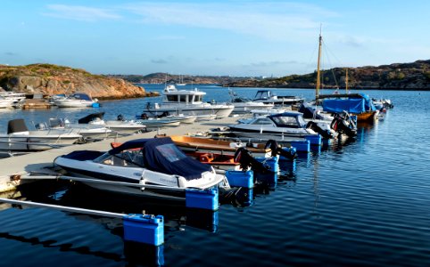 Jetty with boats in Norra Grundsund harbor photo