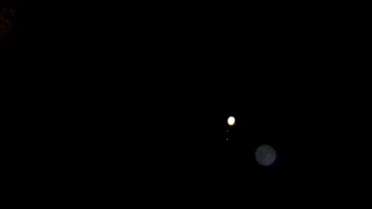 Jupiter and two moons, through Taubaté's sky