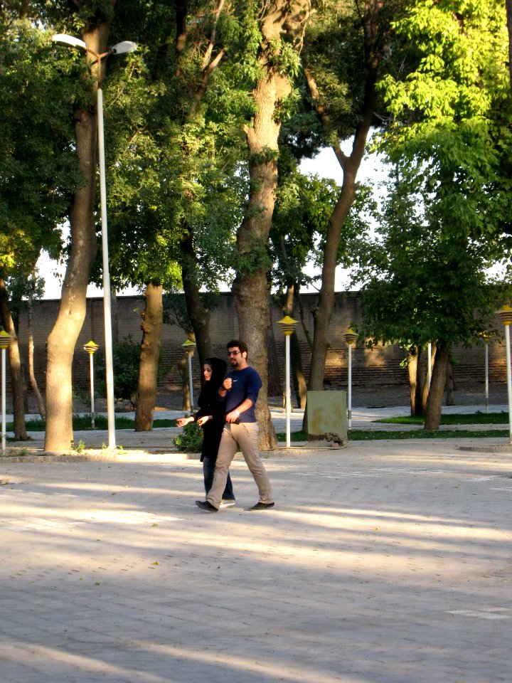 Iranian Man and his wife walking and talking - Mohammad Al Mahruq Mosque - Nishapur 1