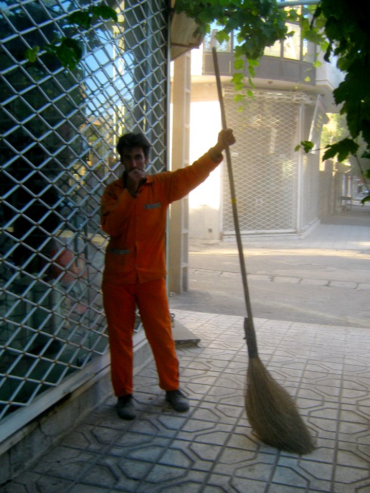 Iranian street sweeper at sidewalk - Nishapur 1