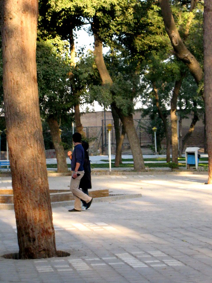 Iranian Man and his wife walking and talking - Mohammad Al Mahruq Mosque - Nishapur 3