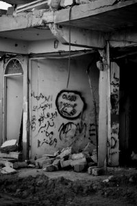 Islamic State graffiti in the ruins of Sinjar in July of 2019, following war with the Islamic State 18