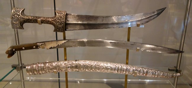 Jambiya (above), Turkey, Ottoman dynasty, 18th century, steel, silver, with Yatagan (below), Turkey, Ottoman dynasty, inscribed 866 (1866 AD), steel, silver, horn - Royal Ontario Museum - DSC04588