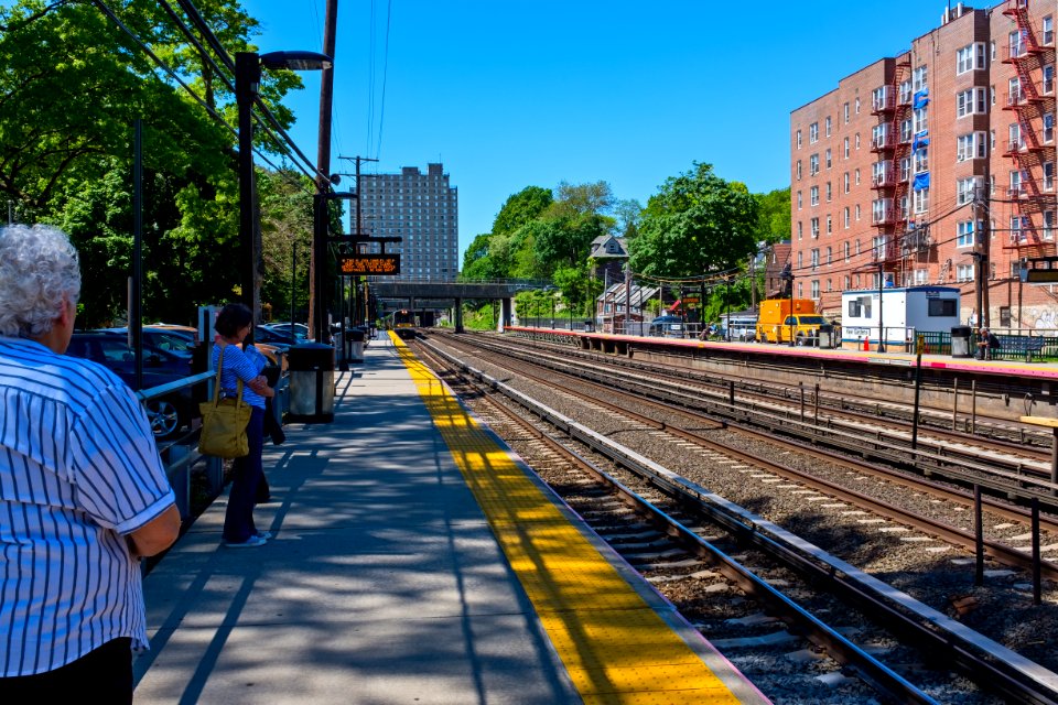 Kew Gardens LIRR station with approaching train (M7) from Penn Station NYC