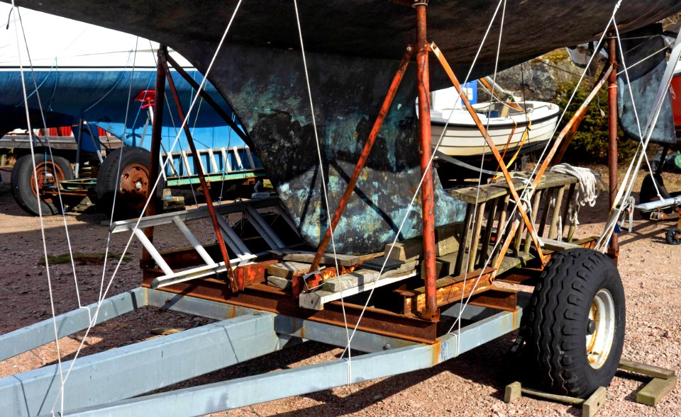Keel of a sailboat resting on a boat trailer