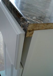 Kitchen renovation 9a reason why wood strips needed to elevate laminate so cabinet drawer closes