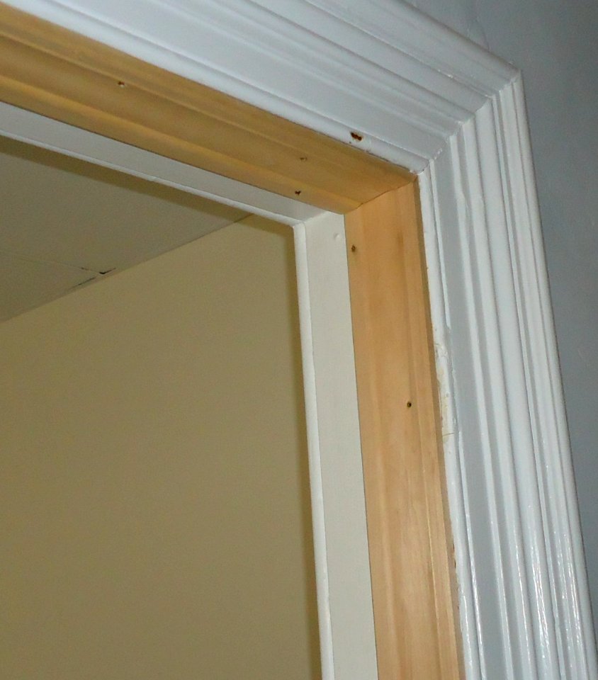 Kitchen renovation hiding damaged molding with new molding