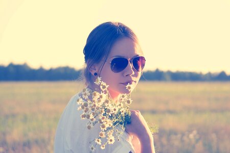 Woman face daisy field photo