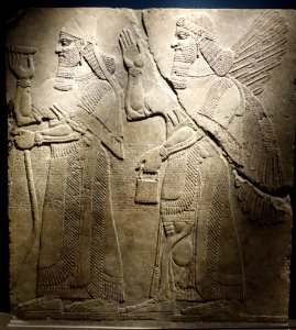 King Ashur-nasir-pal II and a Winged Genie - Room H, Northwest Palace, Nimrud (Kalhu), Iraq, Neo-Assyrian Period, reign of Ashur-nasir-pal II, c. 883-859 BC, alabaster - Brooklyn Museum - Brooklyn, NY - DSC08618