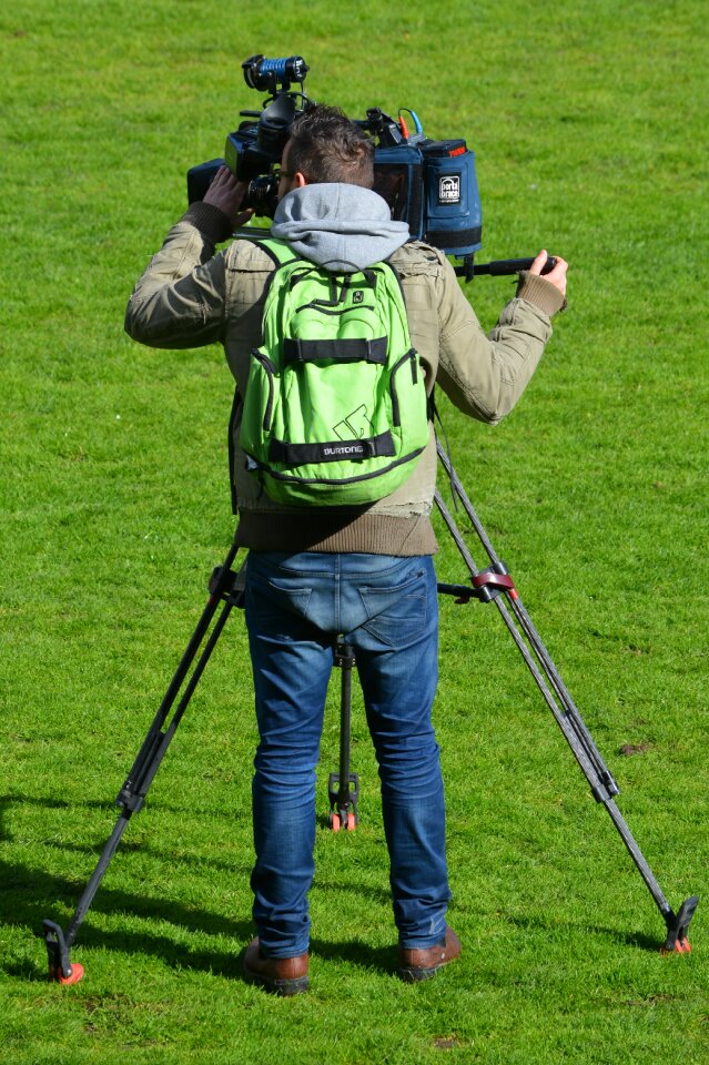 People filming man
