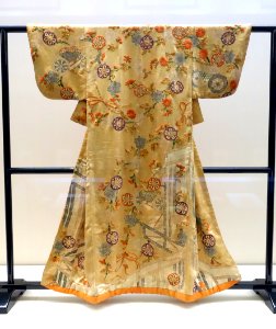Kosode (garment with small wrist openings), Edo period, 18th century, fence, cherry, chrysanthemum and flower cart design on saffron figured satin ground - Tokyo National Museum - DSC06206