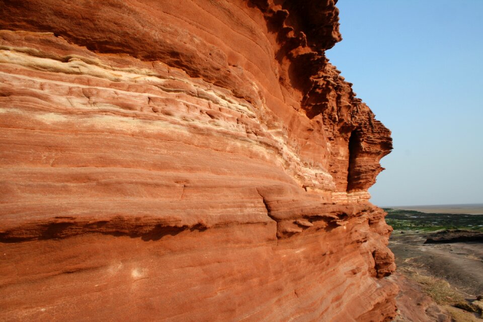 Island tidal erosion red rocks
