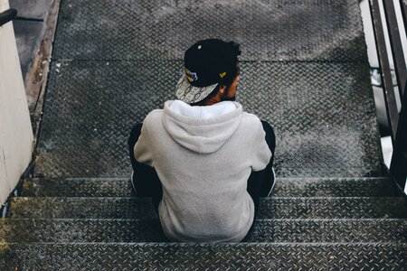 Person sitting staircase photo