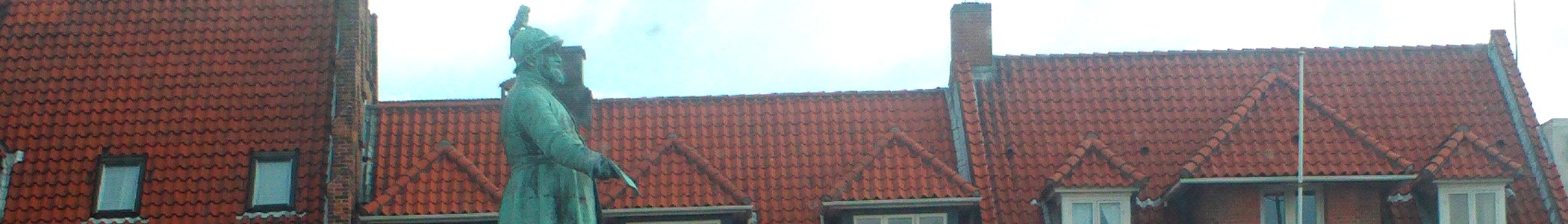 Koge banner Tiled roofs and statue photo