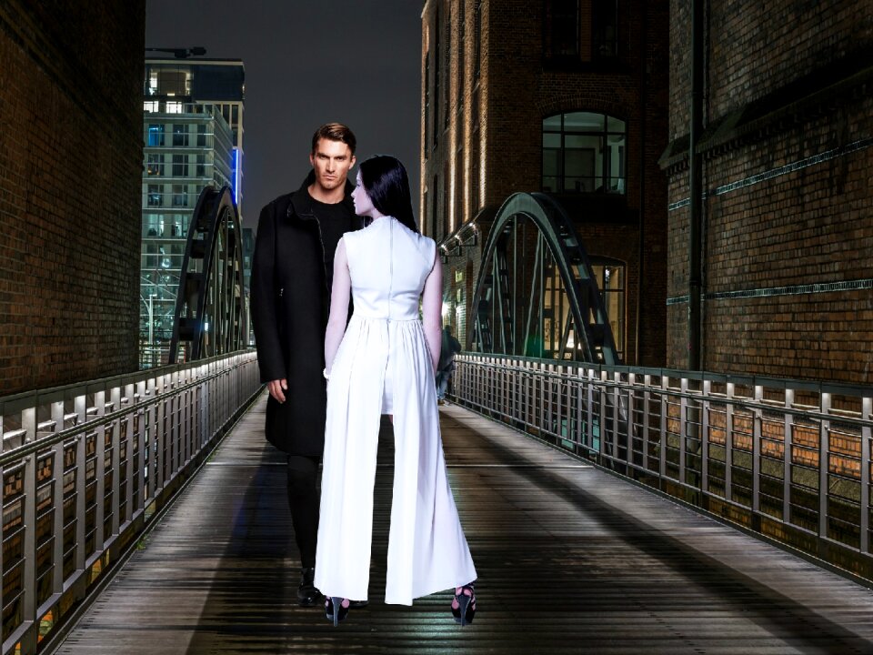 Woman in white man in black unmarried couple