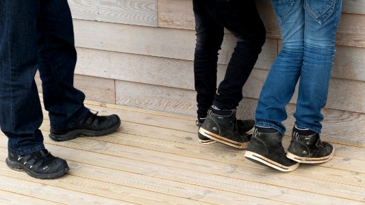 Legs of a dad and two kids