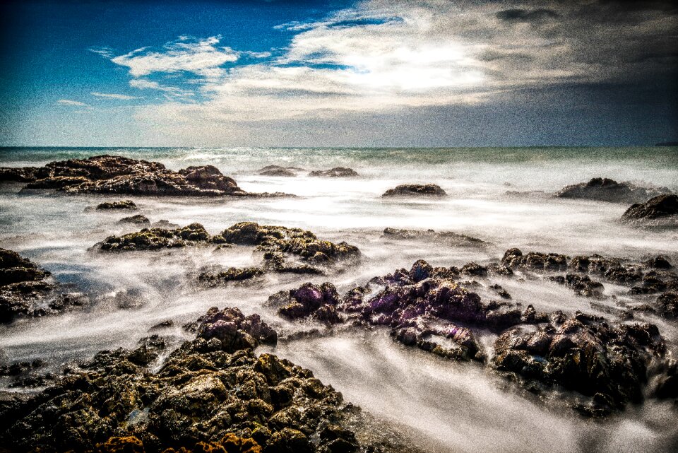 Rock beach long exposure sea photo