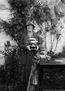 Lady holding a cup, Builth Wells Golf Club (1294277)