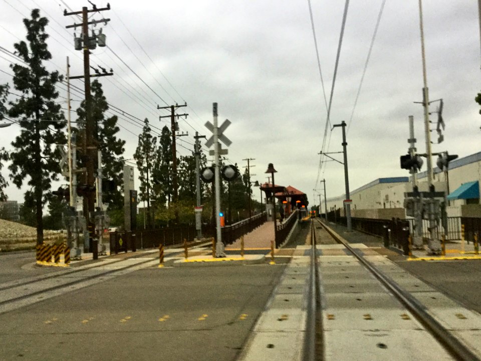 LACMTA Gold Line Duarte Station, with departing train in distance