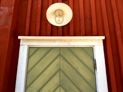 Lamp over door on house on Röe gård photo