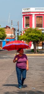 Lady walking down Main Street in the vicinity of the Plaza Bolivar in the Ports of Altagracia