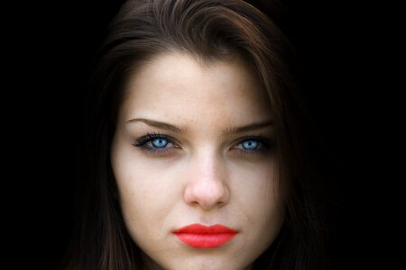 Black background blue eyes red lips