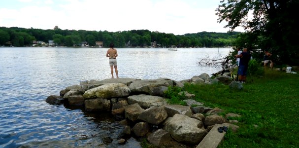 Lake Hopatcong State Park NJ fishing area woman on promontory