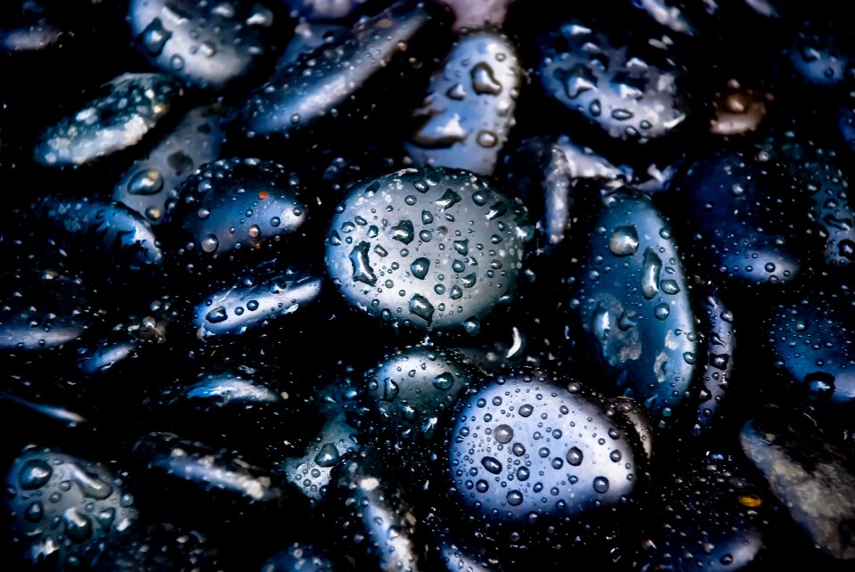 Black pebbles rain pebbles