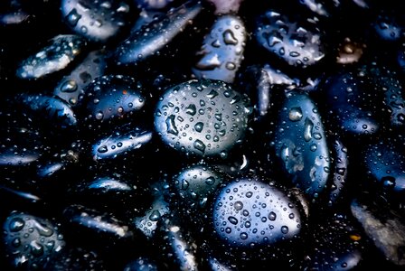 Black pebbles rain pebbles