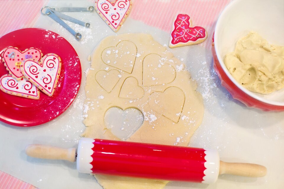 Heart-shaped cookies dough rolling pin photo