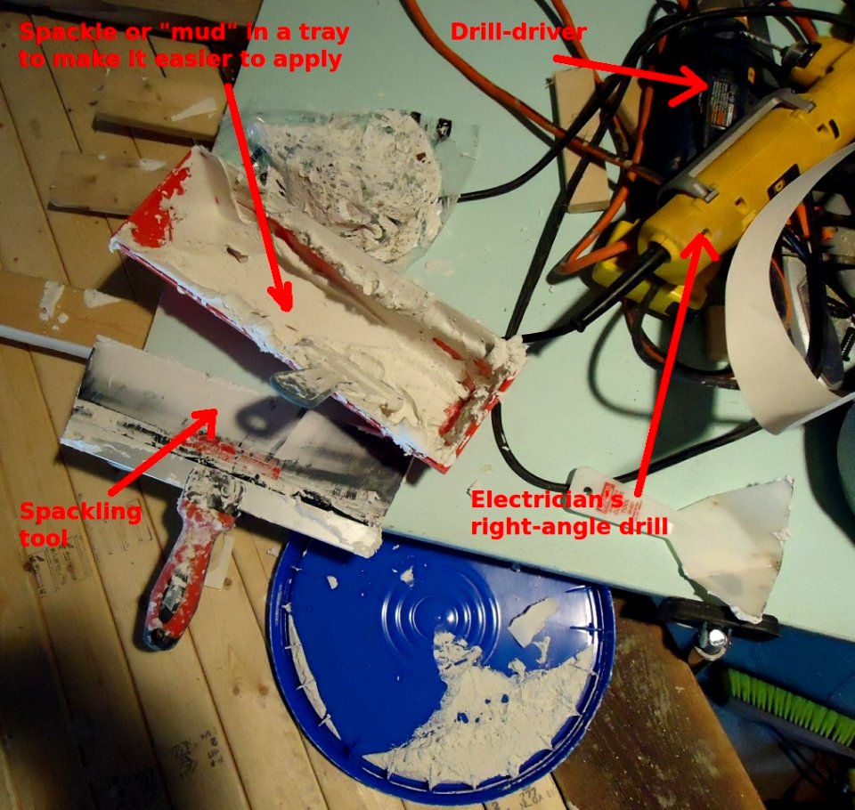 Looking down at platform at tools, spackle, drills