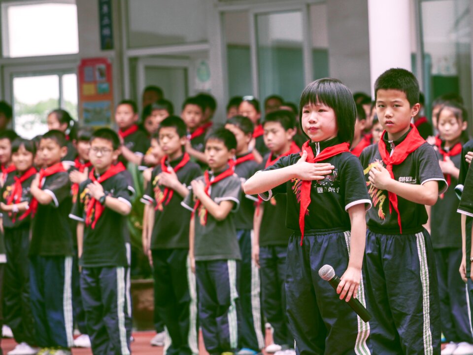 Children red scarf queue