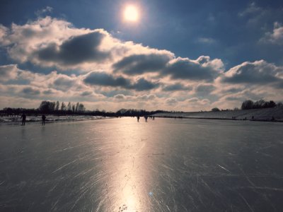 Lower course riverscape with skaters