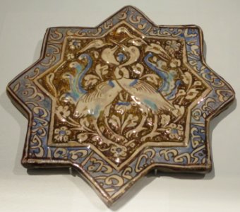 Lusterware star tile with entwined cranes, Iran (Kashan), Ilkhanid, 13th-14th century photo