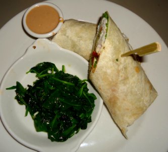 Lunch chicken wrap with spinach and sauce