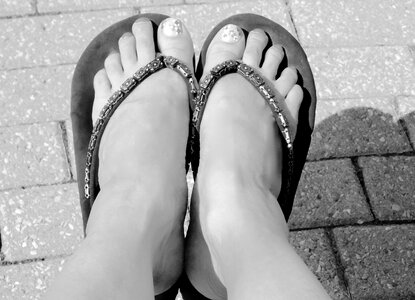 Black and white feet sandals photo