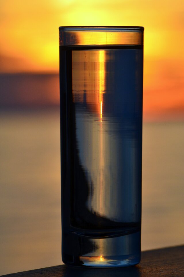 Sunset glass by the sea sunset beach