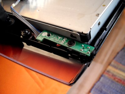 LG M2762D disassembly - headphone jack on front bezel for left bottom edge